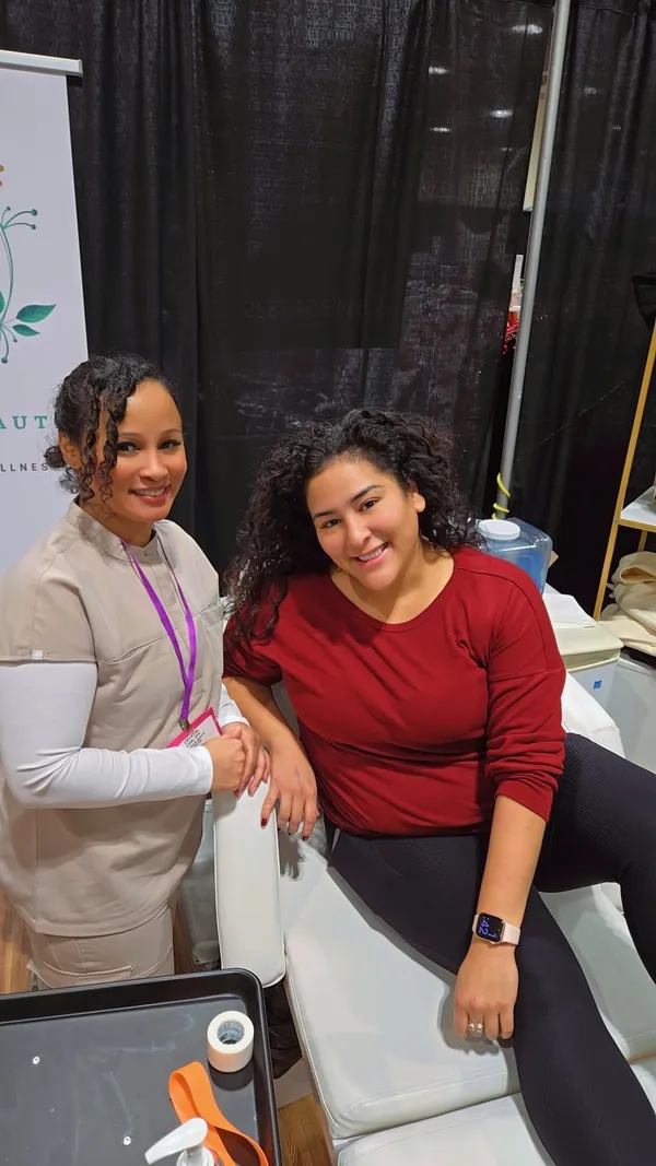 Crystal Simm, RPN, with a smiling client at Chrysalis Beauté