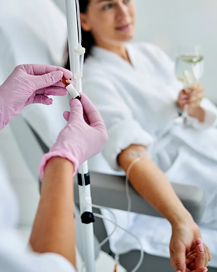 A glutathione drip being prepared for a relaxing wellness session